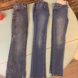Three pairs of size 8 girls jeans.